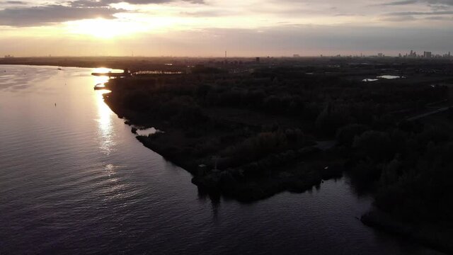 Silhouetted Town Of Barendrecht During Golden Hour In Netherlands, Near Rotterdam, South Holland. - Aerial Shot