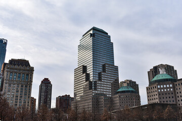 Fototapeta na wymiar City skyscrapers in winter and cloudy sky