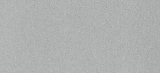 Clean grey cardboard paper background texture. Horizontal banner