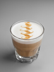 Delicious hot latte coffee in a beautiful glass