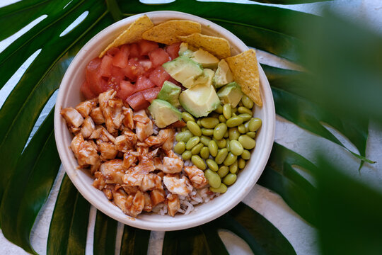 Delicious poke bowl with chicken and veggies