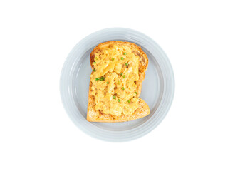 Scrambled eggs  served with toasted bread on a blue plate. isolated white background. clipping path.