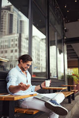 Positive delighted male person communicating per video call