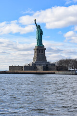 Statue of liberty city in the day and cloudy sky