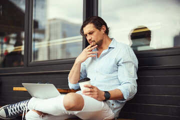 Concentrated male person being deep in thoughts