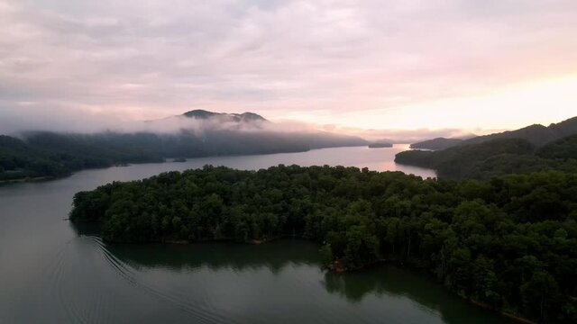 aerial tilt up scenic watauga lake in east tennessee, a tva dam