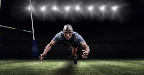 Naklejka premium Portrait of african american male athlete diving against stadium in background