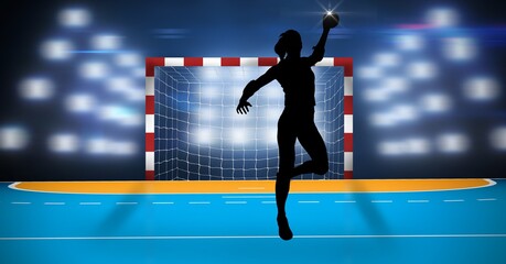 Fototapeta na wymiar Composition of female handball player over sports stadium