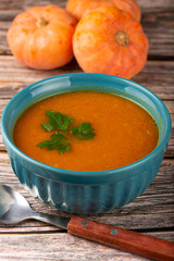 Delicious homemade pumpkin soup in bowl.