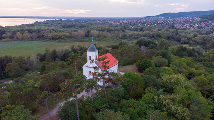 Fototapeta na wymiar Aerial view of the hilltop chapel (St. Michael's Chapel) near Lake Balaton, at Vonyarcvashegy at sunset