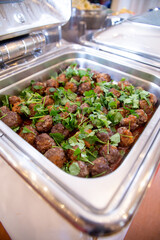 beef meatballs with sauce and herbs in the restaurant