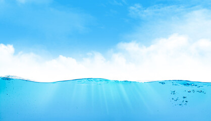 Waterline with sea underwater and blue sunny sky