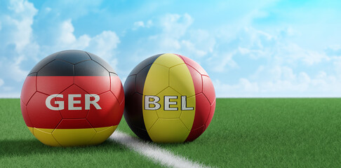 Germany vs. Belgium Soccer Match - Leather balls in German and Belgium national colors on a soccer field. Copy space on the right side - 3D Rendering 