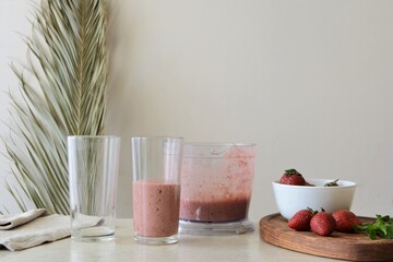 Strawberry smoothie in a glass on the table. Healthy food concept © Maria Volkova