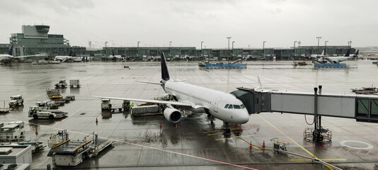 Plane to the airport in rainy weather