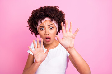 Photo portrait of scared girl ignoring refusing staring opened mouth isolated on pastel pink color...