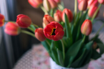 Red tulips. Bouquet of tulips. Bouquet of red flowers. wildflowers. Tulip. Plants. Floristics. Present. A gift for a woman. Flowers for a woman. Bouquet on the table.