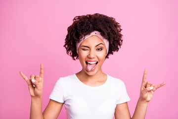 Photo of crazy rocker lady showing horns tongue out mouth close eye wear white t-shirt isolated...