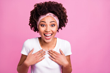 Photo of excited amazed african woman palms chest open mouth wear white t-shirt isolated pink background