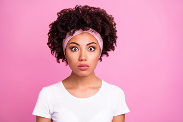 Photo of young charming pretty amazed surprised afro girl hear shocking news information isolated on pink color background