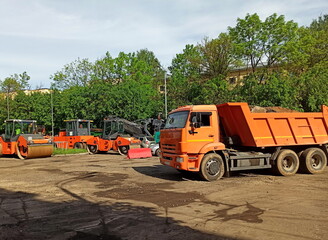 kamaz with sand and equipment for road repair