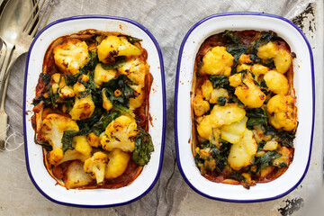 Saag aloo vegan pie with bean filling and potato and cauliflower topping