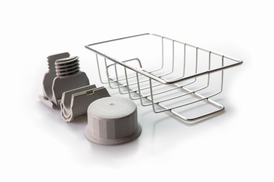 Close-up, Wire soap holder, Metal basket sponge holder for bathroom & kitchen on white background. Selective focus.