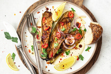 Grilled zucchini with sauce and tahini