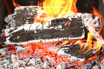 In the grill for frying meat, the flame of fire burns beautifully. Flame in case of fire.