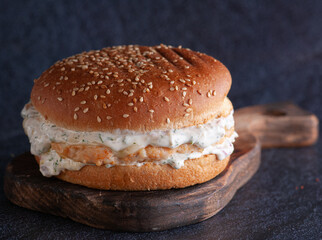 burger stuffed on a wooden stand