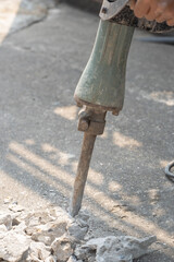 Road drilling equipment in use