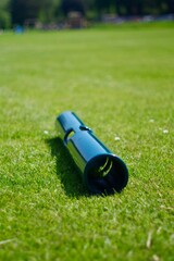 pipe for weight training on green grass