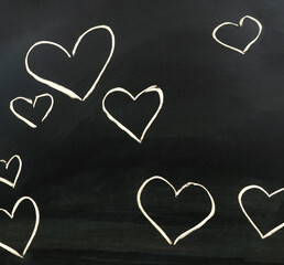 Hearts drawn in chalk on a blackboard