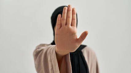 Selective focus on open palm meaning stop