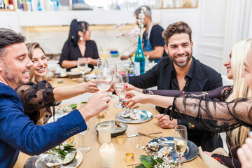 Group of friends enjoying dinner at home
