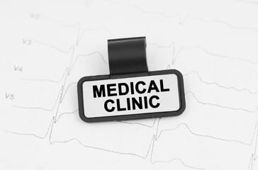 There is a plate on the cardiogram with the inscription - Medical Clinic