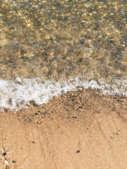 surf on the beach, sandy beach with pebbles