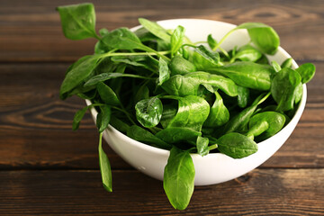 spinach in a plate on a table. Healthy wholesome food. Vegetarian food. Selective soft focus