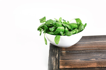 spinach in a plate on a table. Healthy wholesome food. Vegetarian food. Selective soft focus