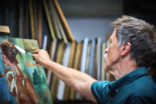 Artist painting in art studio