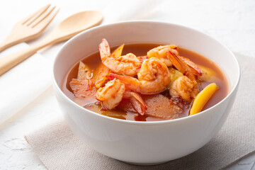 Sour Soup with Papaya and Shrimp in white bowl.Thai food