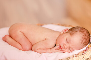 Sleeping naked newborn baby