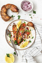 Grilled zucchini with sauce and tahini