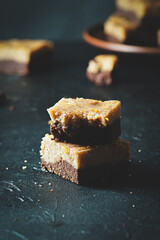 Pieces of chocolate brownie with lemon layer.