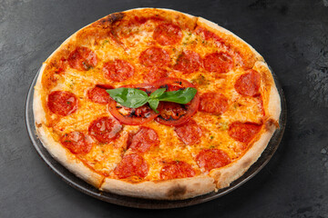 pepperoni pizza on a dark background. close-up.