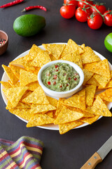 Guacamole with corn chips nachos. Mexican food. Vegetarian food.