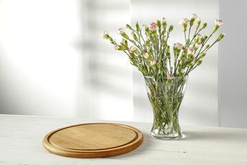 Fresh flowers on desk and wall background 