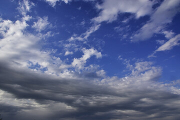 Naklejka na ściany i meble Light white clouds in the blue sky