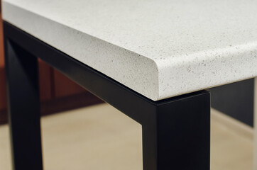 Modern plastic table top with edging. Close-up.