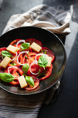 tomato salad and cheese veggie vegetable basil on the table healthy food diet meal snack copy space background rustic. top view vegetarian food